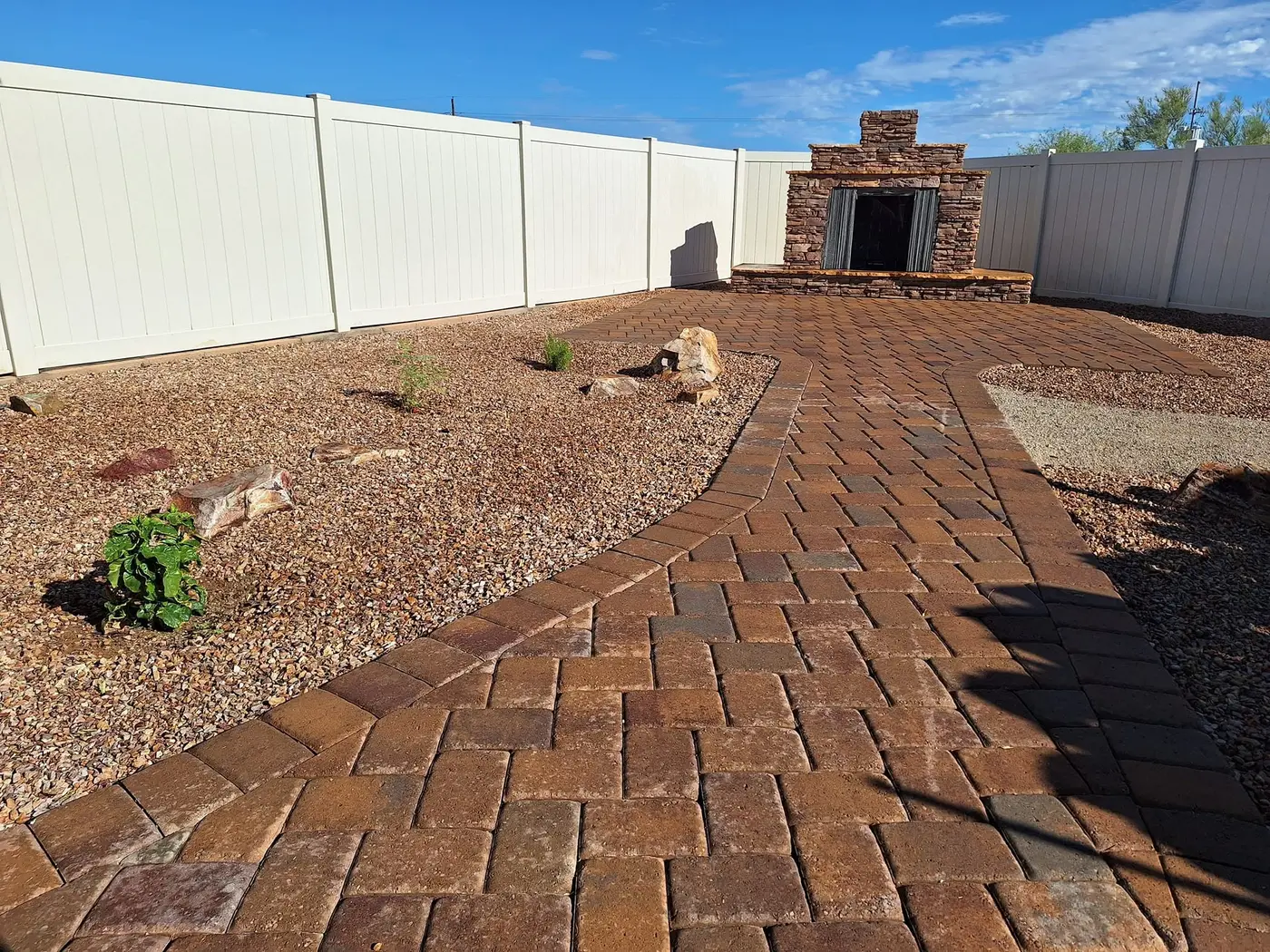 Outdoor Fireplace & Patio by Mota Landscapes